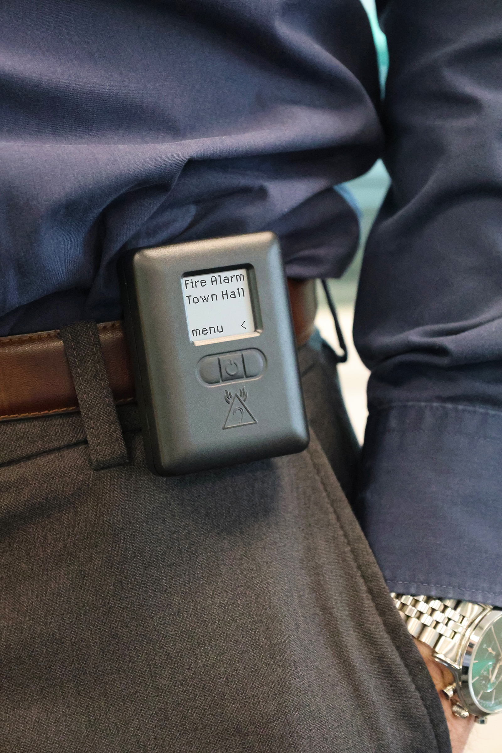 An image showing the new Alerter attached to a user's belt